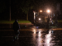 ROYAL OAK, MI - AUGUST 24, 2023: Firemen from the Royal Oak Fire Department blockade a flooded street after a severe thunderstorm that inclu...