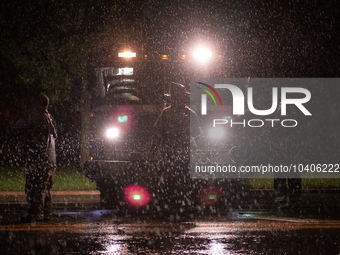 ROYAL OAK, MI - AUGUST 24, 2023: Firemen from the Royal Oak Fire Department blockade a flooded street after a severe thunderstorm that inclu...