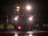 ROYAL OAK, MI - AUGUST 24, 2023: Firemen from the Royal Oak Fire Department blockade a flooded street after a severe thunderstorm that inclu...