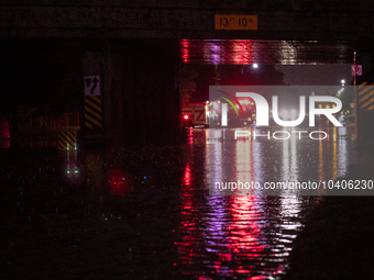 ROYAL OAK, MI - AUGUST 24, 2023: Firemen from the Royal Oak Fire Department blockade a flooded street after a severe thunderstorm that inclu...