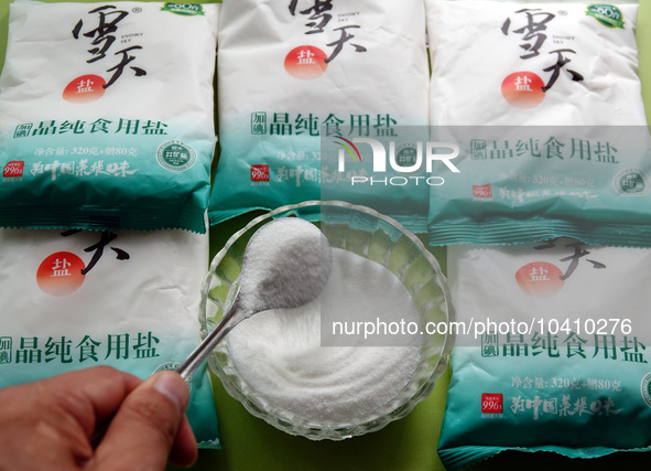 YICHANG, CHINA - AUGUST 26, 2023 - A citizen shows salt he bought in Yichang, Hubei province, China, Aug 26, 2023. Recently, affected by the...