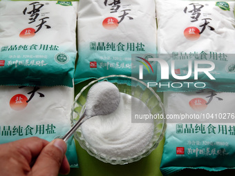 YICHANG, CHINA - AUGUST 26, 2023 - A citizen shows salt he bought in Yichang, Hubei province, China, Aug 26, 2023. Recently, affected by the...