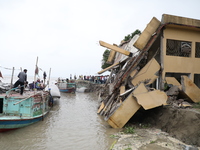 The image shows Mukundia Government Primary School collapse due to Padma river erosion on Tuesday night, August 24, 2023.  (