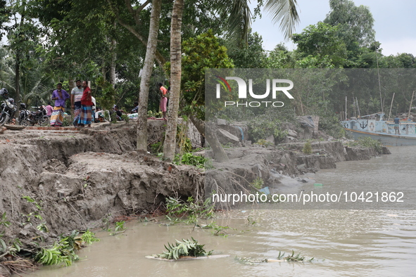 The image shows Mukundia Government Primary School collapse due to Padma river erosion on Tuesday night, August 24, 2023.  