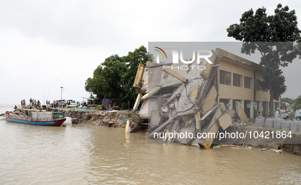 The image shows Mukundia Government Primary School collapse due to Padma river erosion on Tuesday night, August 24, 2023.  