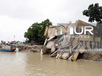 The image shows Mukundia Government Primary School collapse due to Padma river erosion on Tuesday night, August 24, 2023.  (