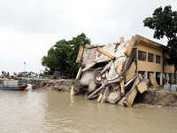 The image shows Mukundia Government Primary School collapse due to Padma river erosion on Tuesday night, August 24, 2023.  (