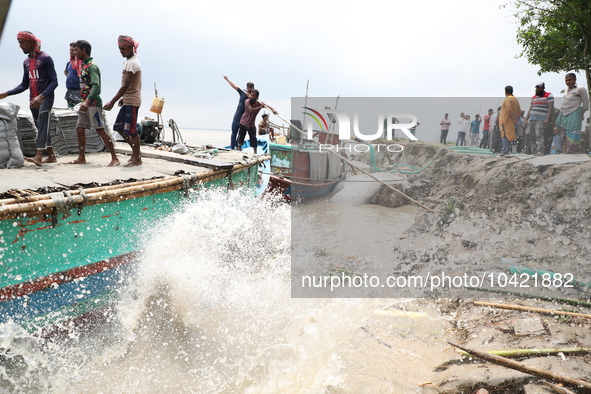 The image shows Mukundia Government Primary School collapse due to Padma river erosion on Tuesday night, August 24, 2023.  