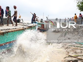 The image shows Mukundia Government Primary School collapse due to Padma river erosion on Tuesday night, August 24, 2023.  (