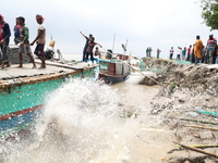 The image shows Mukundia Government Primary School collapse due to Padma river erosion on Tuesday night, August 24, 2023.  (