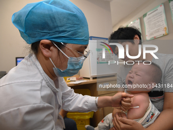 GUIYANG, CHINA - AUGUST 30, 2023 - A medical worker inoculates infants against influenza in Guiyang, Guizhou province, China, August 30, 202...