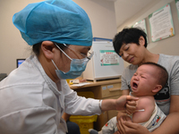 GUIYANG, CHINA - AUGUST 30, 2023 - A medical worker inoculates infants against influenza in Guiyang, Guizhou province, China, August 30, 202...