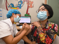 GUIYANG, CHINA - AUGUST 30, 2023 - A medical worker inoculates people against influenza in Guiyang, Guizhou province, China, August 30, 2023...