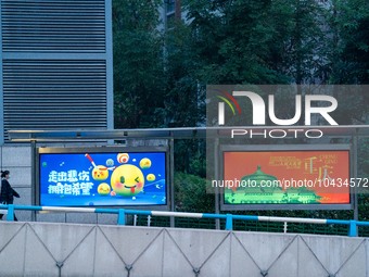 CHONGQING, CHINA - NOVEMBER 18, 2022 - (FILE) A citizen passes by a bus stop in Chongqing, China, November 18, 2022. With the rapid developm...