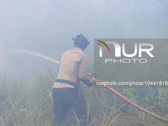 Firefighters from Regional Disaster Management Agency (BPBD) personnel and Indonesian Police Personnel from Ogan Ilir Regency are currently...