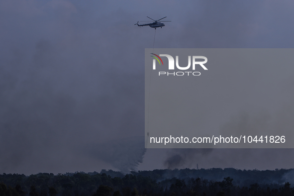 Firefighters from Regional Disaster Management Agency (BPBD) personnel and Indonesian Police Personnel from Ogan Ilir Regency are currently...