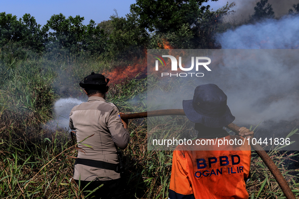 Firefighters from Regional Disaster Management Agency (BPBD) personnel and Indonesian Police Personnel from Ogan Ilir Regency are currently...