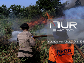 Firefighters from Regional Disaster Management Agency (BPBD) personnel and Indonesian Police Personnel from Ogan Ilir Regency are currently...