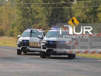 Police block local roads after mandatory evacuations have been ordered during a fast-moving wildfire in Walker County, Texas.  (