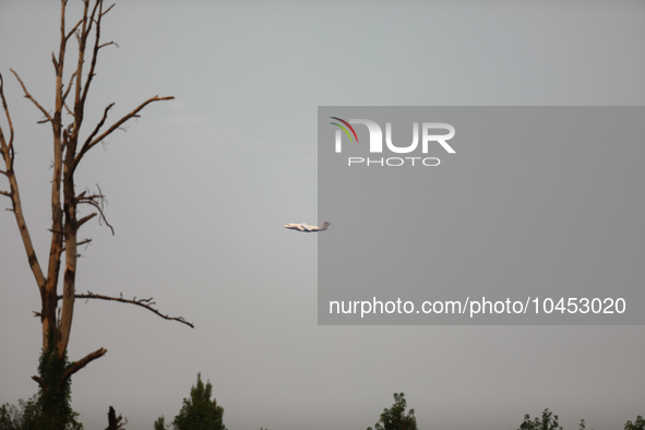 A firefighting aircraft passes through smoke from a wildfire in Walker County, Texas on September 2, 2023.  