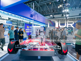  Citizens look at the architecture of new energy vehicles at the 2023 SMART CHINA EXPO in Chongqing, China, Sept. 5, 2023. (