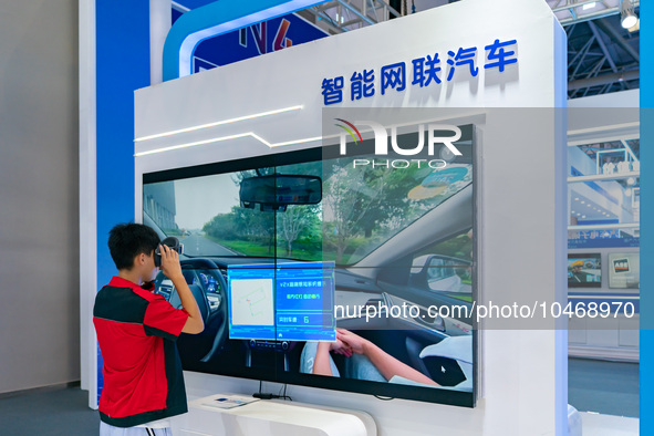  Citizens experience connected cars at the 2023 SMART CHINA EXPO in Chongqing, China, Sept. 5, 2023. 