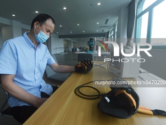 Citizens perform finger recovery training at Hangzhou Rehabilitation Hospital in Hangzhou, east China's Zhejiang province, Sept 6, 2023. (