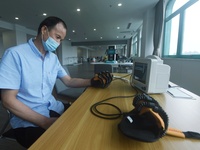 Citizens perform finger recovery training at Hangzhou Rehabilitation Hospital in Hangzhou, east China's Zhejiang province, Sept 6, 2023. (