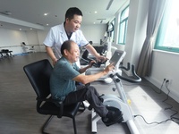 Citizens perform leg and foot recovery training with the help of medical staff at Hangzhou Rehabilitation Hospital in Hangzhou, East China's...