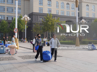 DEZHOU, CHINA - SEPTEMBER 7, 2023 - Students of Dezhou University in Shandong province carry their luggage and prepare to go to the grassroo...