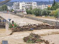 The aftermath of the fierce rainstorms hit central Greece showing the damage from the floods while roads are still covered by floodwater and...