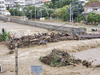 The aftermath of the fierce rainstorms hit central Greece showing the damage from the floods while roads are still covered by floodwater and...