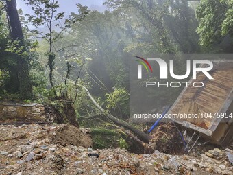 Pelion Mountain hit by the fierce rainstorm causing damage or vanishing the road network and houses collapsing in landslides while trapped p...