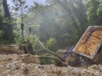 Pelion Mountain hit by the fierce rainstorm causing damage or vanishing the road network and houses collapsing in landslides while trapped p...