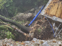 Pelion Mountain hit by the fierce rainstorm causing damage or vanishing the road network and houses collapsing in landslides while trapped p...