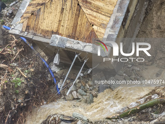 Pelion Mountain hit by the fierce rainstorm causing damage or vanishing the road network and houses collapsing in landslides while trapped p...