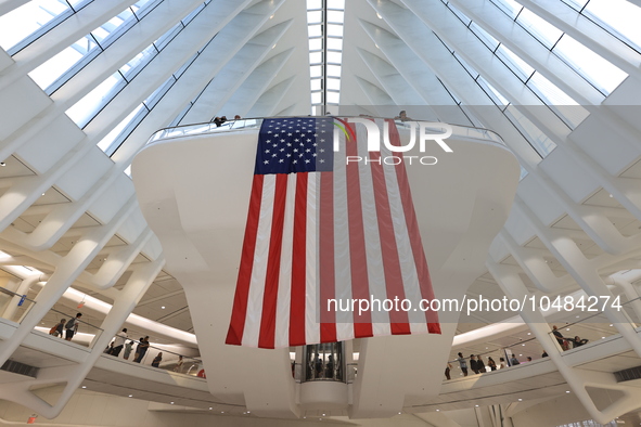 The Oculus at the World Trade Center is fill with crowds as U.S. flags from ceiling to commemorate the 9/11 Anniversary in New York, New Yor...