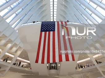 The Oculus at the World Trade Center is fill with crowds as U.S. flags from ceiling to commemorate the 9/11 Anniversary in New York, New Yor...