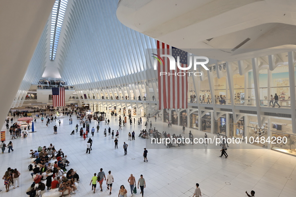 The Oculus at the World Trade Center is fill with crowds as U.S. flags from ceiling to commemorate the 9/11 Anniversary in New York, New Yor...