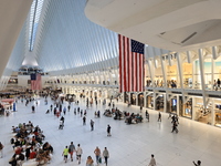 The Oculus at the World Trade Center is fill with crowds as U.S. flags from ceiling to commemorate the 9/11 Anniversary in New York, New Yor...