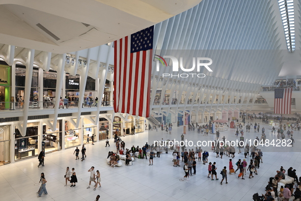 The Oculus at the World Trade Center is fill with crowds as U.S. flags from ceiling to commemorate the 9/11 Anniversary in New York, New Yor...