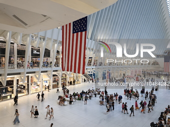 The Oculus at the World Trade Center is fill with crowds as U.S. flags from ceiling to commemorate the 9/11 Anniversary in New York, New Yor...