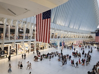 The Oculus at the World Trade Center is fill with crowds as U.S. flags from ceiling to commemorate the 9/11 Anniversary in New York, New Yor...