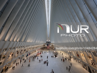 The Oculus at the World Trade Center is fill with crowds as U.S. flags from ceiling to commemorate the 9/11 Anniversary in New York, New Yor...