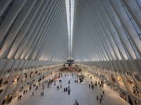 The Oculus at the World Trade Center is fill with crowds as U.S. flags from ceiling to commemorate the 9/11 Anniversary in New York, New Yor...