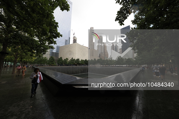 Flowers and US flags are laid on one of the North Pool panels at World Trade Center Memorial to commemorate the 9/11 Anniversary in New York...