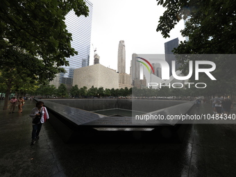 Flowers and US flags are laid on one of the North Pool panels at World Trade Center Memorial to commemorate the 9/11 Anniversary in New York...