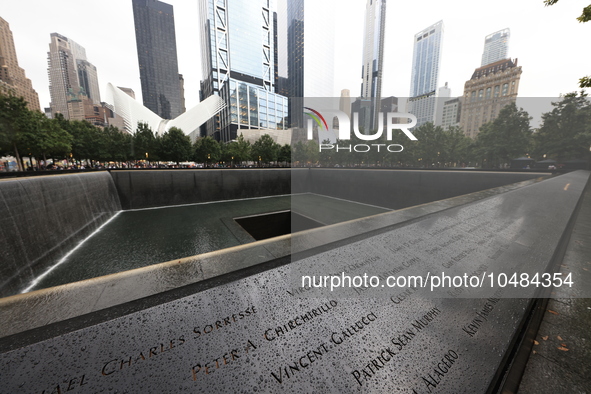 Flowers and US flags are laid on one of the North Pool panels at World Trade Center Memorial to commemorate the 9/11 Anniversary in New York...