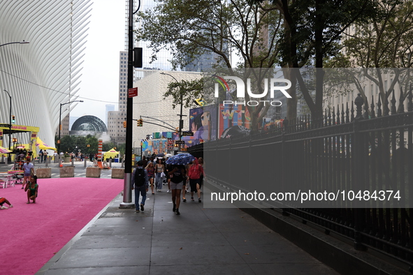 Pedestrians make their way along Fulton Street next to St. Paul's Chapel of Trinity Church in New York, New York, Saturday, Sept. 9, 2023. 