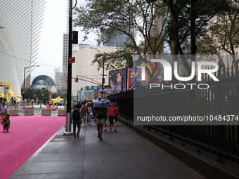 Pedestrians make their way along Fulton Street next to St. Paul's Chapel of Trinity Church in New York, New York, Saturday, Sept. 9, 2023. (